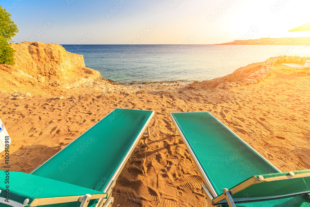 Landscape of Two Lonely beachchairs on the sand near sea Landscape of Two Lonely beachchairs on the sand near sea