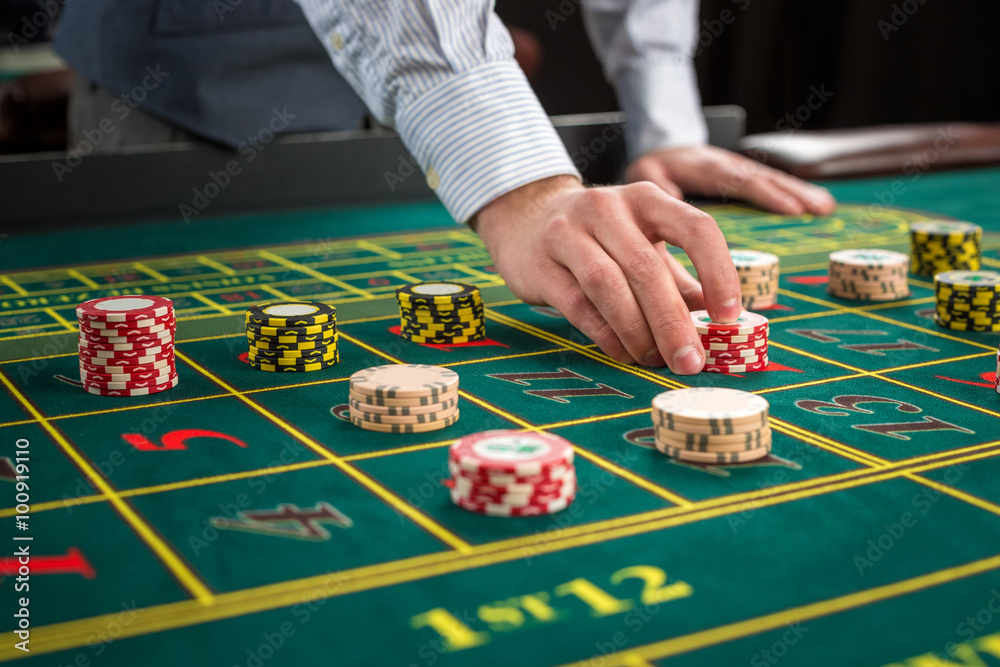 Picture of a green table and betting with chips. Picture of a green table and betting with chips.