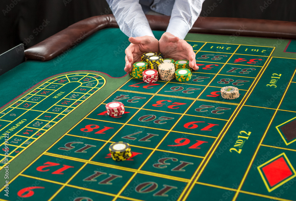 Picture of a green table and betting with chips. Picture of a green table and betting with chips.