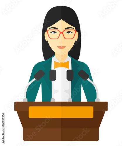Woman speaking on podium.