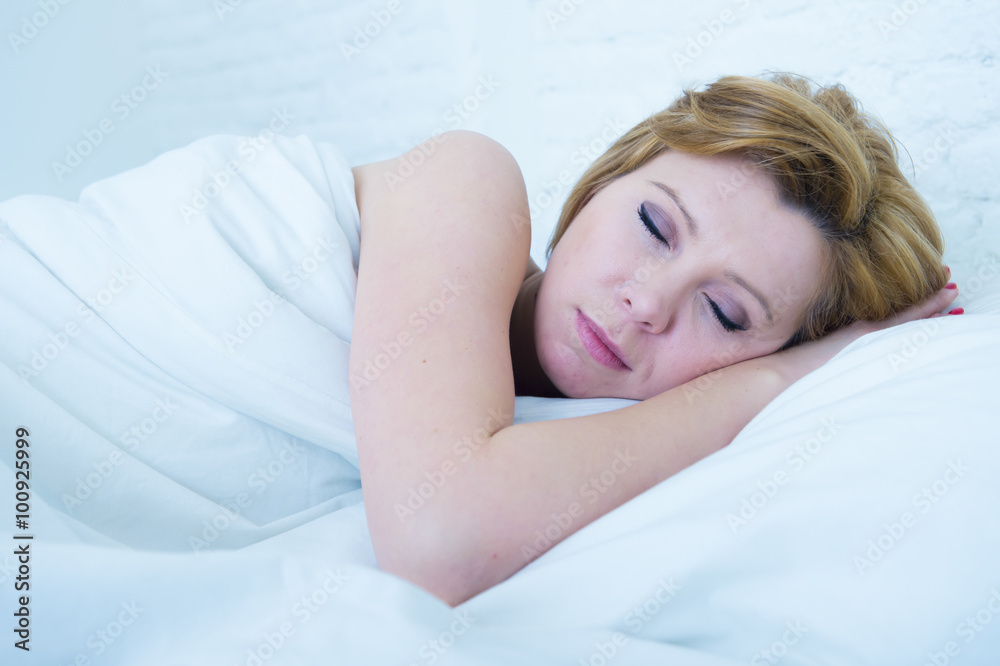 face of young attractive woman with red hair sleeping peacefully in bed at home resting and dreaming face of young attractive woman with red hair sleeping peacefully in bed at home resting and dreaming
