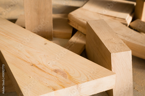 Wood trims lie on a workbench in the carpentry workshop