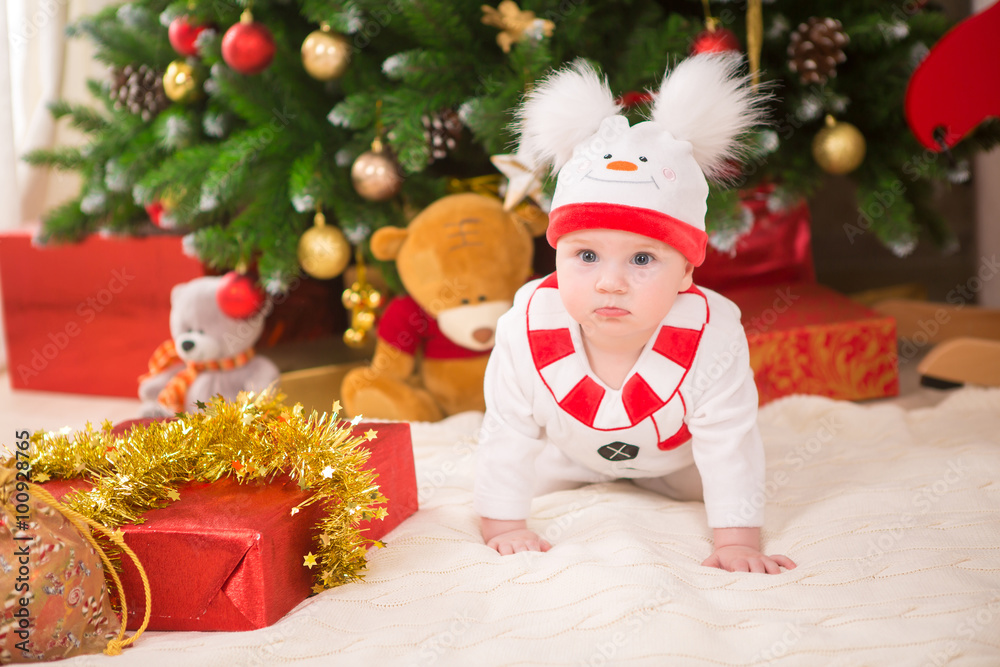 baby with costume snowman with Christmas tree baby with costume snowman with Christmas tree