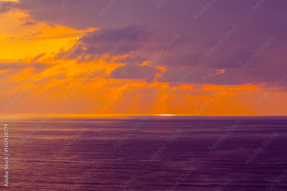 Purple cloudy sunset over sea
