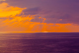 Purple cloudy sunset over sea