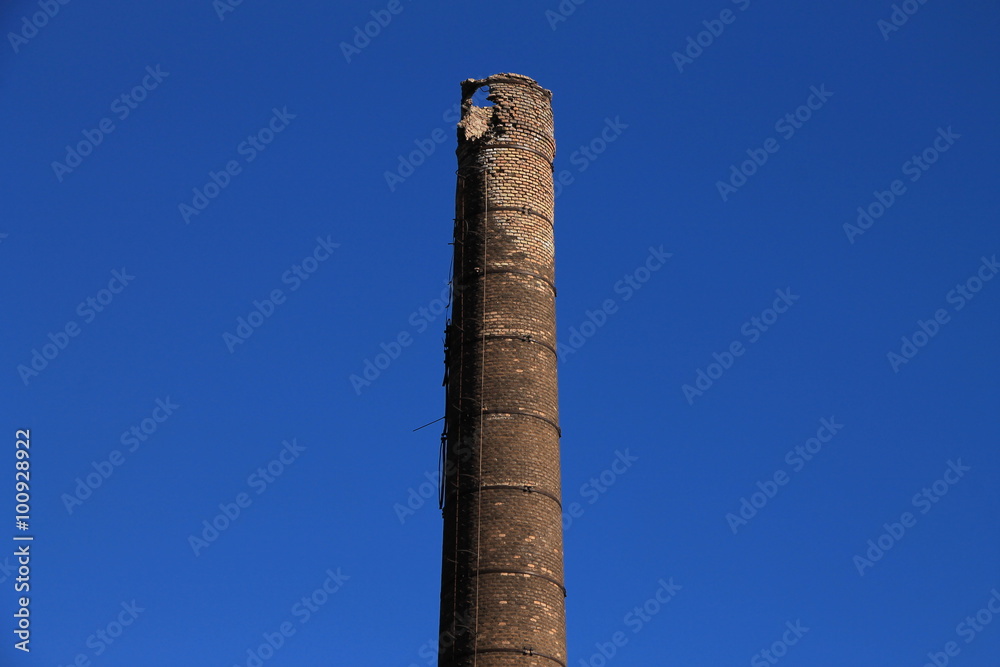 Tall brick chimney in old factory , Bosnia and Herzegovina