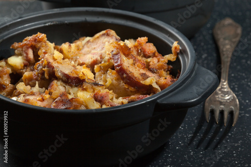 Potatoes baked with sausage and bacon