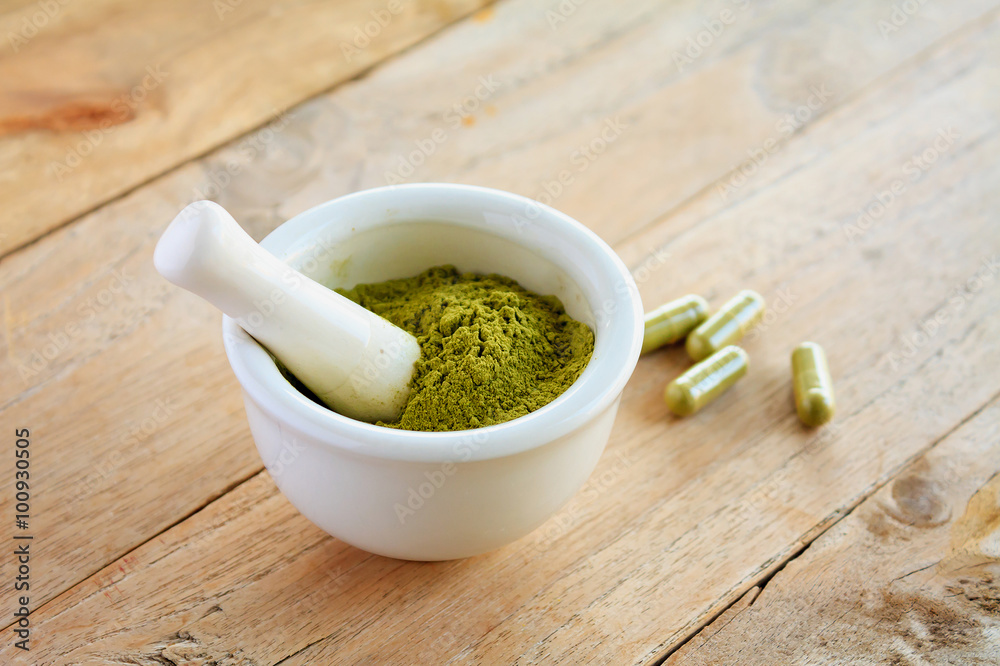 Fresh herbs powder in the mortar, alternative medicine Fresh herbs powder in the mortar, alternative medicine