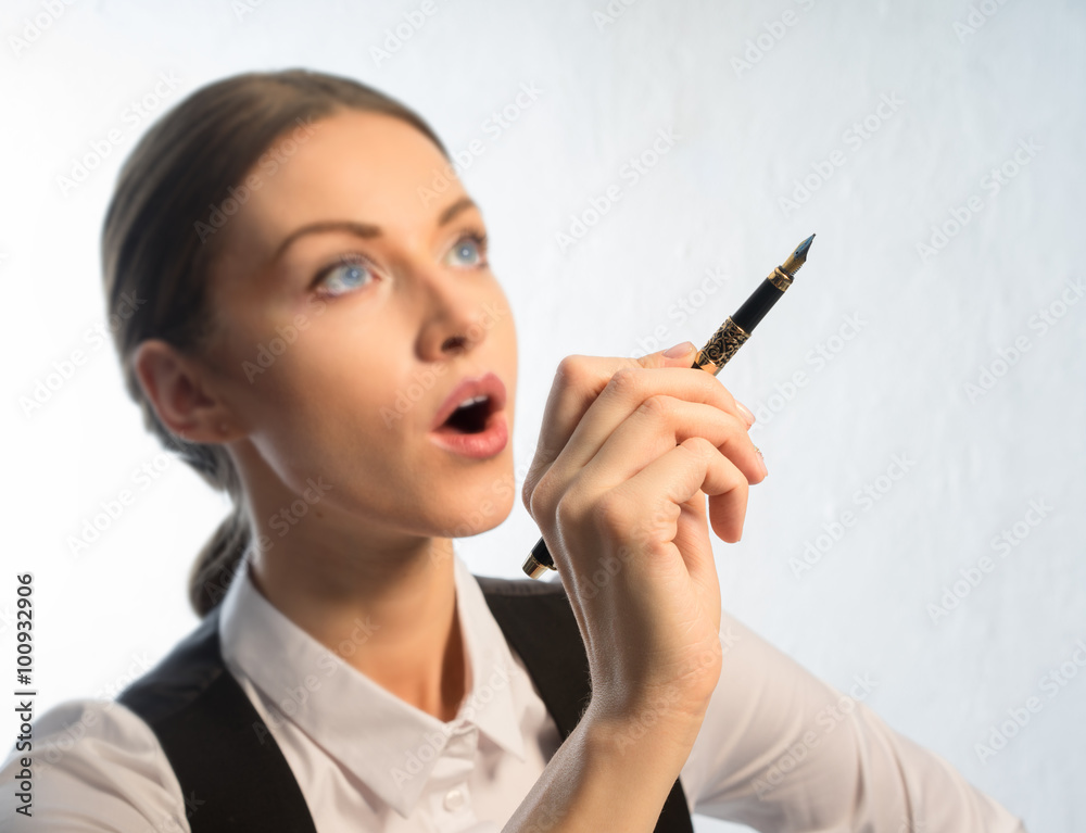 The girl - manager, a waistcoat and a fountain pen in his hand, came up with a new idea The girl - manager, a waistcoat and a fountain pen in his hand, came up with a new idea