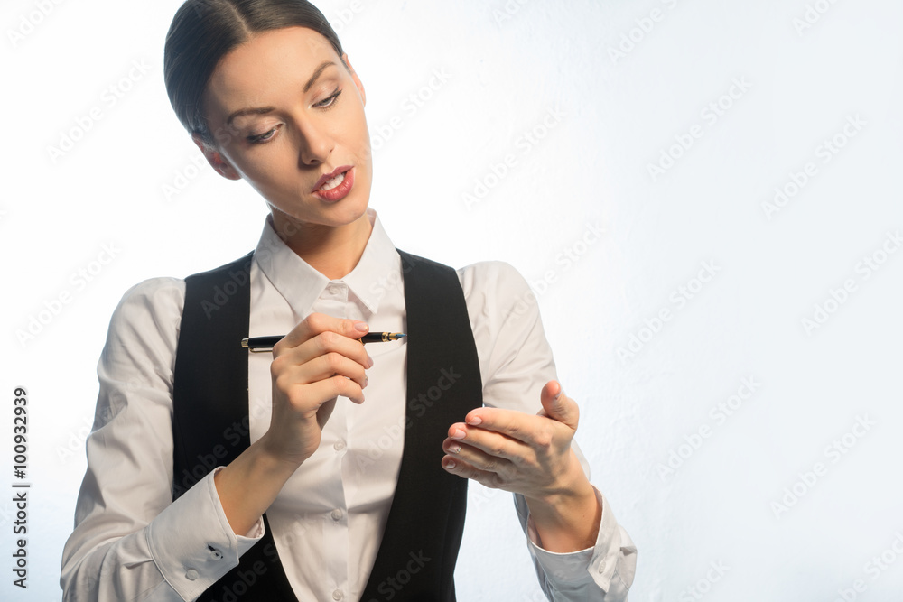 The girl - manager, a waistcoat and a fountain pen in his hand. The girl - manager, a waistcoat and a fountain pen in his hand.