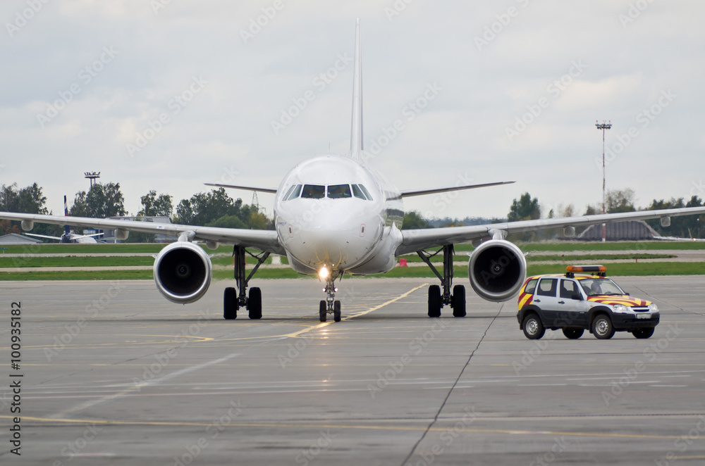 Airplane taxiing after Follow me car Airplane taxiing after Follow me car