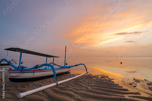 Beach / Ocean sunrise in Sanur with traditional fishing boat, Bali, Indonesia