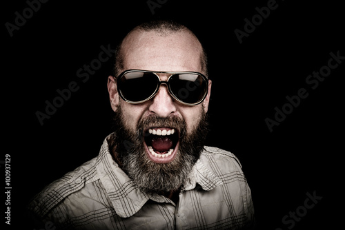 Portrait of a man with beard and sunglasses photo