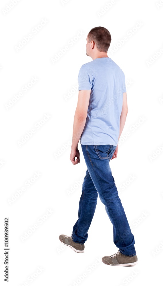 Back view of going handsome man in jeans Back view of going handsome man in jeans