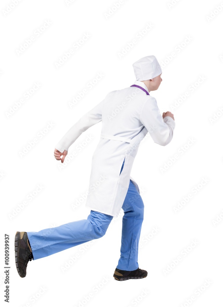Back view of running doctor in a robe hurrying to help the patie Back view of running doctor in a robe hurrying to help the patie