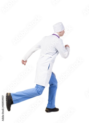 Back view of running doctor in a robe hurrying to help the patie