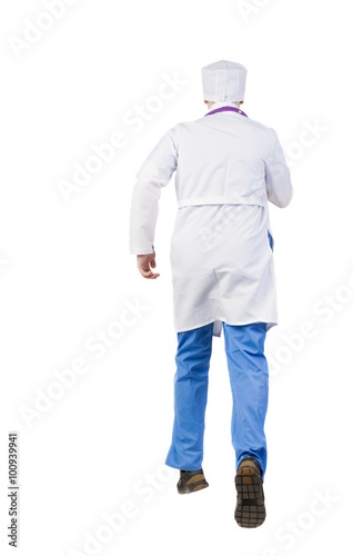 Back view of running doctor in a robe hurrying to help the patie © ghoststone