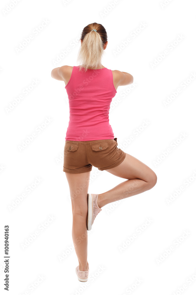 Back view of girl standing in front of a warm up exercise.  Rear