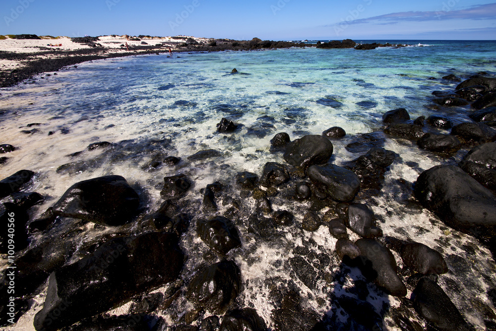 sky light  beach water  in lanzarote  isle foam rock  landscape
