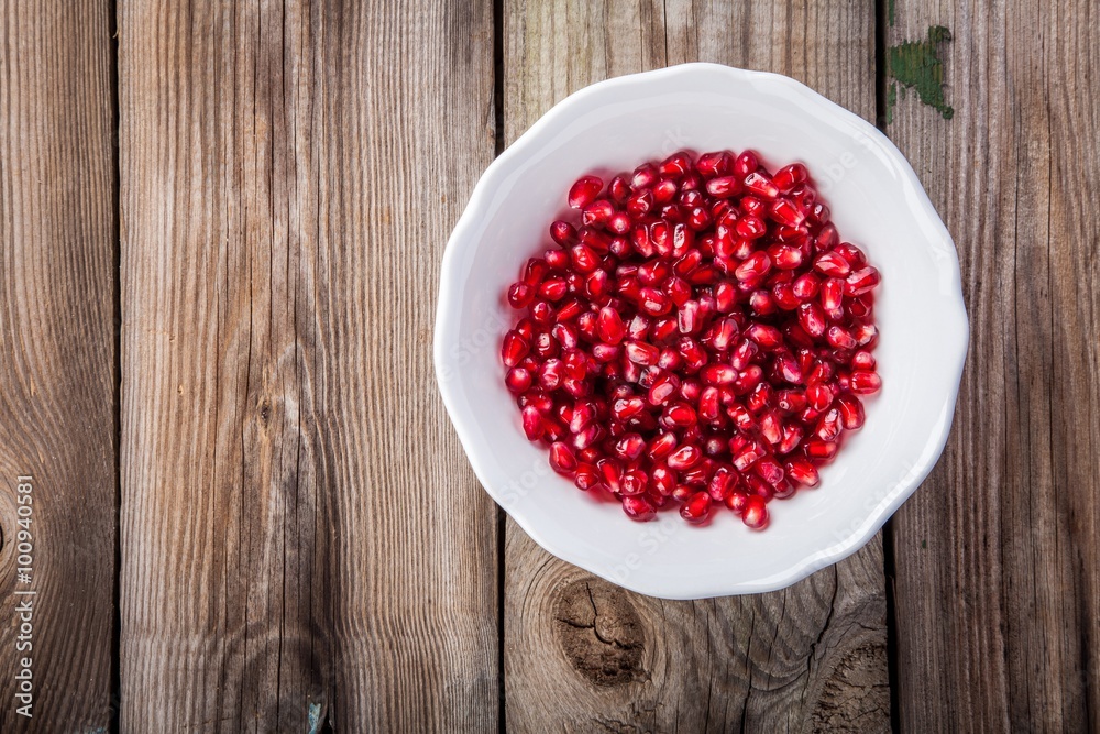 Fresh juicy pomegranate seeds on a plate Fresh juicy pomegranate seeds on a plate