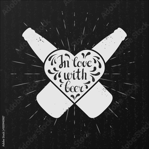 In love with beer. Craft beer bottles and heart on black grunge background. Hand drawn craft beer label with lettering.