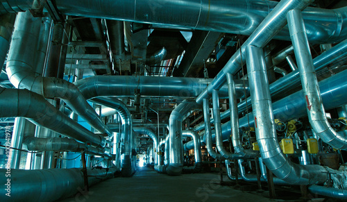 Equipment, cables and piping as found inside of a modern industr