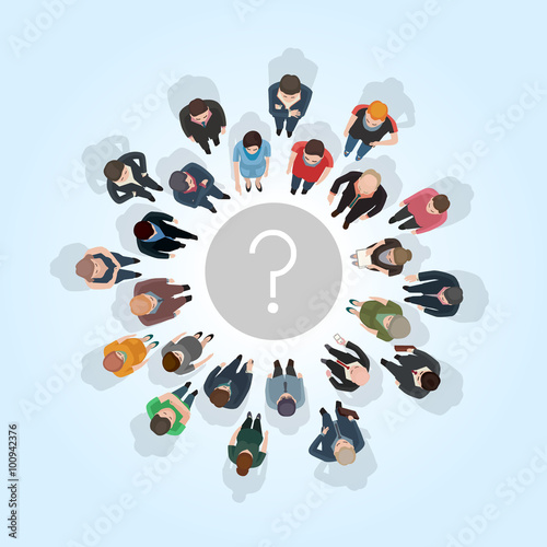 large group of people standing around a question mark