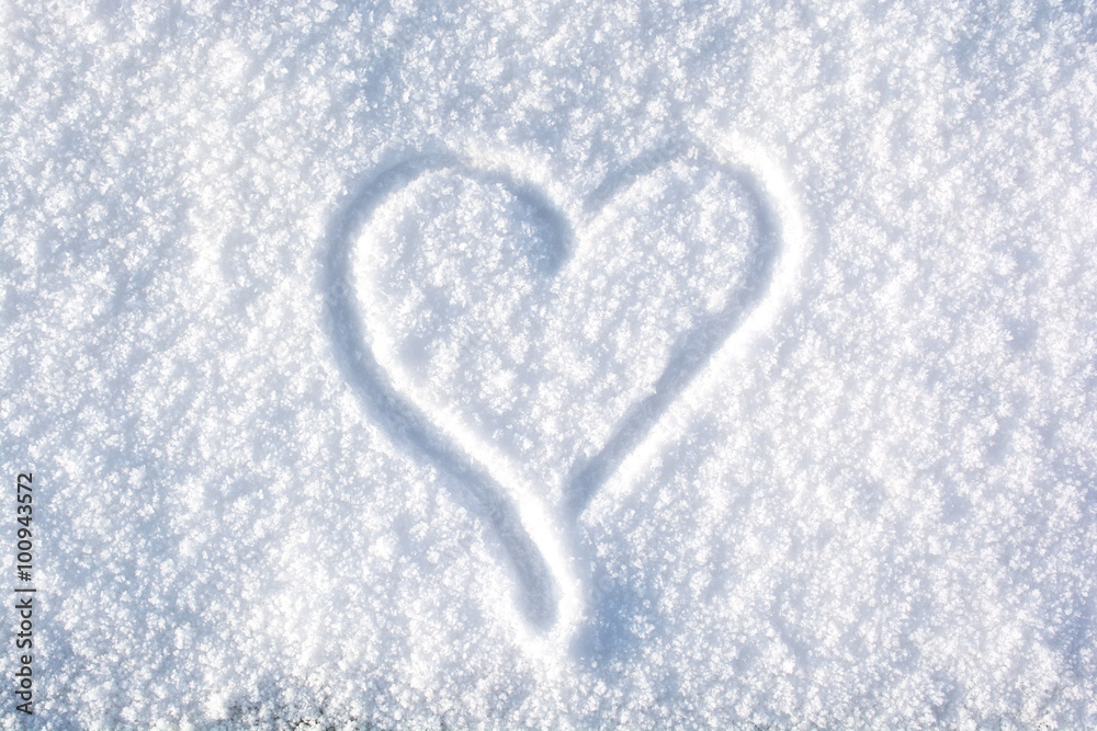 A drawing of a heart in the snow