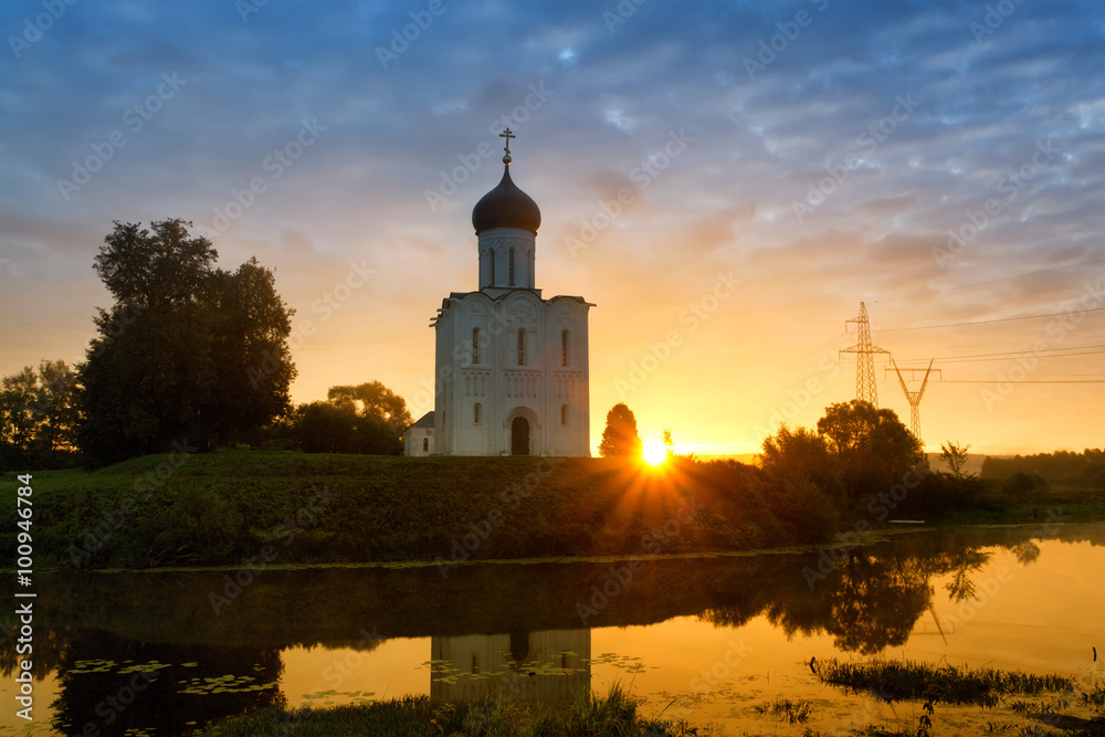 Beautiful sunrise over Church of the Intercession of the Holy Virgin on Nerl River, Bogolyubovo, Russia