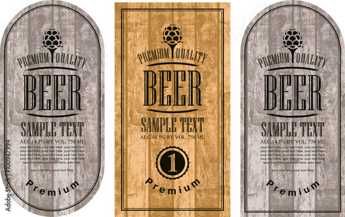 set labels for beer in a retro style with malt against the backdrop of wooden planks