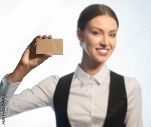 The manager shows a business card