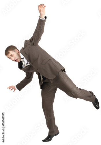 Businessman almost falling 