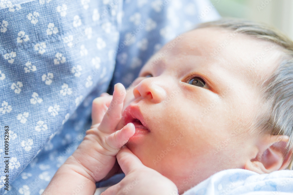 Portrait of father holding his newborn baby Portrait of father holding his newborn baby