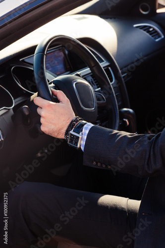 elegant man in his car © Coka