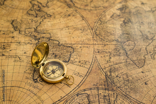 old compass on vintage map