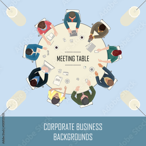 big round meeting table with people sitting around