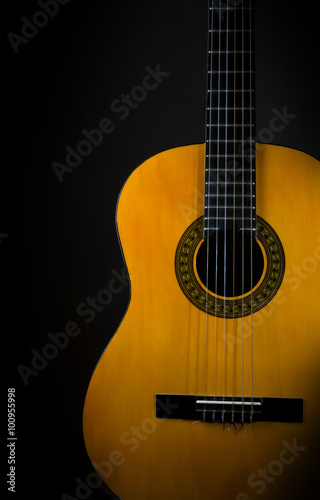 Acoustic guitar on black