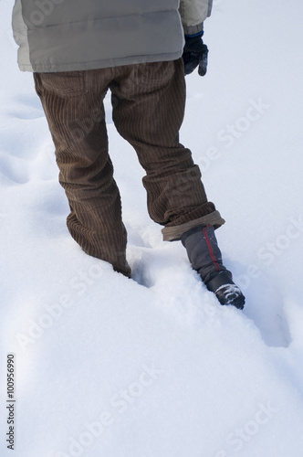 Man Walking Through Snow