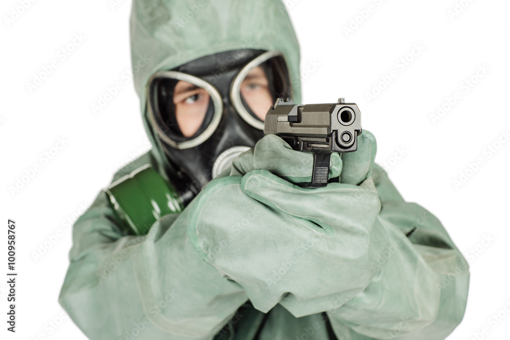 Man with protective mask and protective clothes holding a gun. p Man with protective mask and protective clothes holding a gun. p