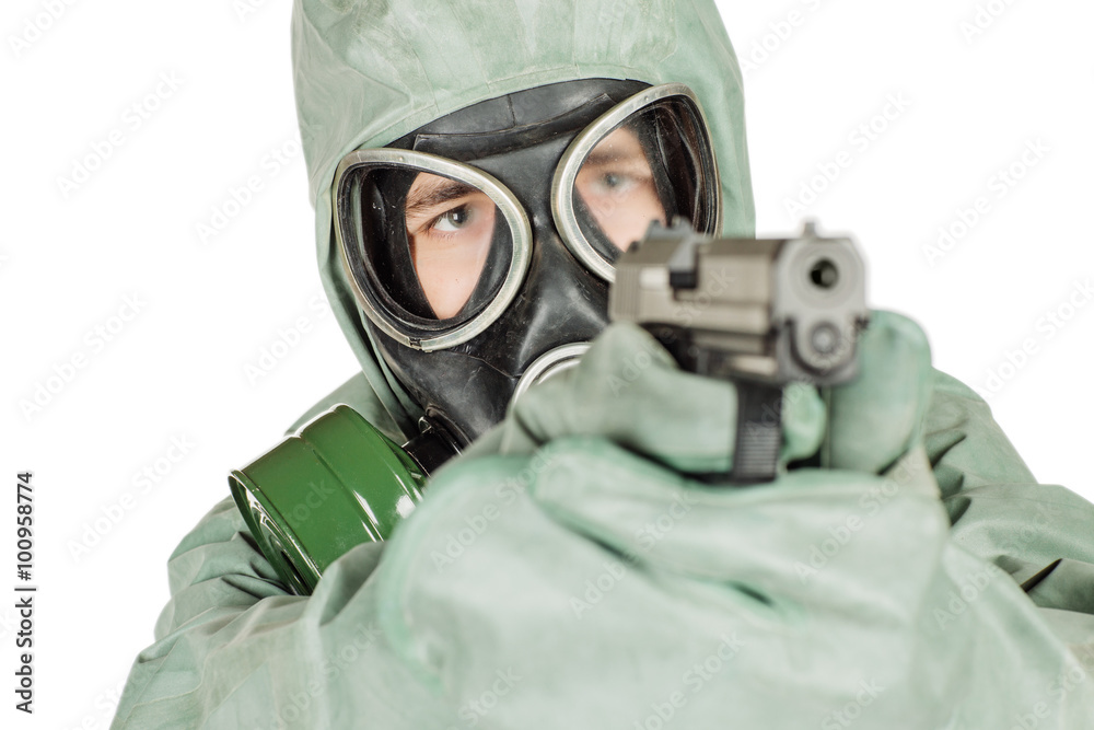 Man with protective mask and protective clothes holding a gun. p Man with protective mask and protective clothes holding a gun. p