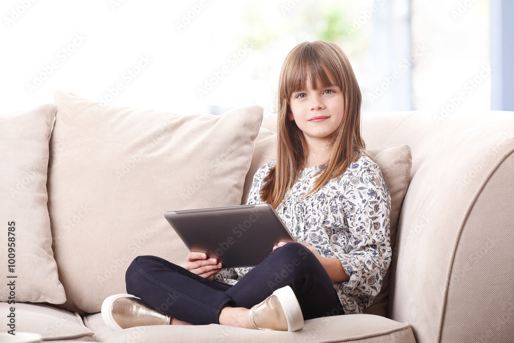 Adorable little girl with digital tablet Adorable little girl with digital tablet