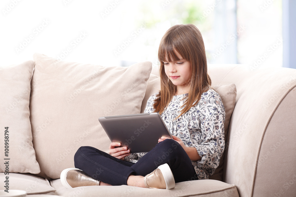 Adorable little girl with digital tablet Adorable little girl with digital tablet
