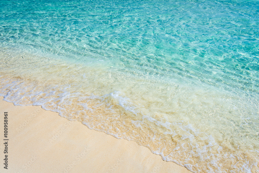 Soft wave of the tropical sea on the sandy beach Soft wave of the tropical sea on the sandy beach