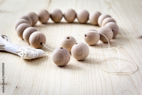 Wooden beads on a wooden background