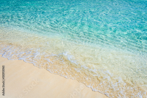 Soft wave of the tropical sea on the sandy beach