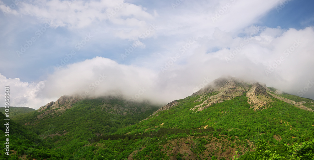 clouds on mountain peaks