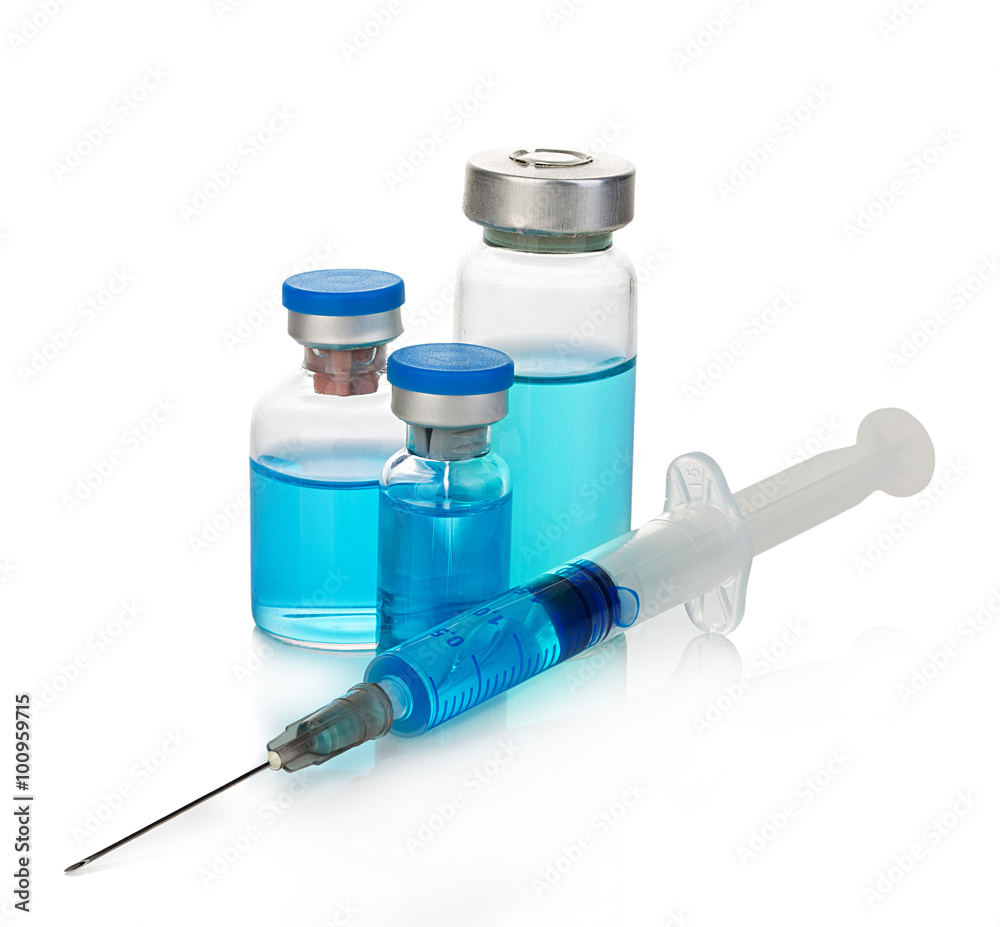 Sterile medical vials with blue medication solution, ampoules, and syringe isolated on a white background. Sterile medical vials with blue medication solution, ampoules, and syringe isolated on a white background.