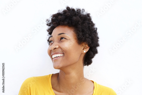 Happy young african woman looking away