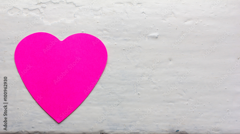 Fototapeta premium Valentine - paper heart magenta colors against the white painted surface. Copy space. Free space for text, Close-up, top view