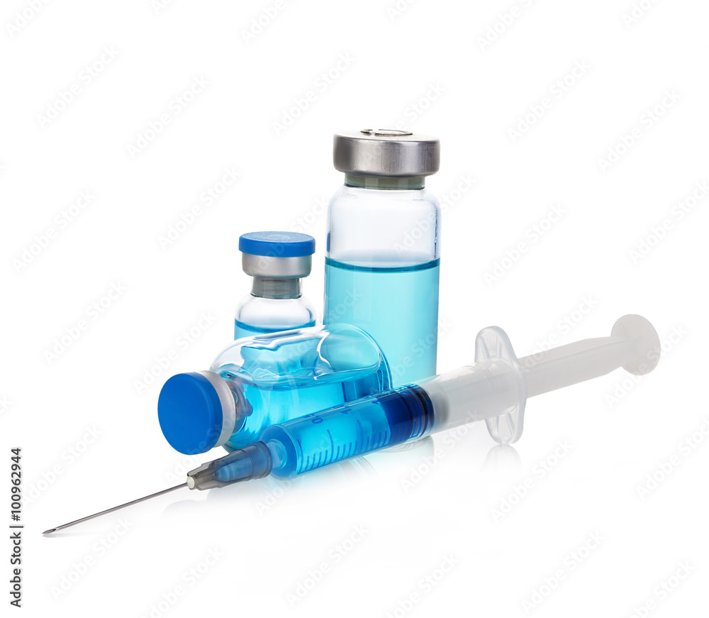 Sterile medical vials with blue medication solution, ampoules, and syringe isolated on a white background. Sterile medical vials with blue medication solution, ampoules, and syringe isolated on a white background.